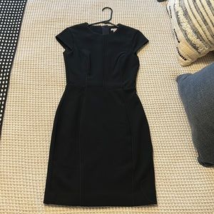 Like new H&M black womens size 2 fitted zip back office mini dress